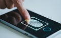 A person using fingerprint authentication on a smartphone for secure access Royalty Free Stock Photo