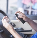 A person is using hand sanitizer sprayer Royalty Free Stock Photo