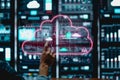 Person using holographic cloud interface in high-tech data center