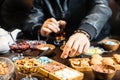 Person Cutting a Piece of Food at a Table Royalty Free Stock Photo