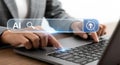 Person using laptop with ai search bar and upload icon overlayed image Royalty Free Stock Photo