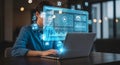 A person using a laptop with augmented reality interfaces and data visualizations Royalty Free Stock Photo