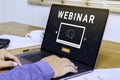 Person using a laptop computer for online training webinars. E-learning browsing connection and cloud online technology webcast Royalty Free Stock Photo
