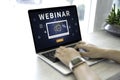 Person using a laptop computer for online training webinars. E-learning browsing connection and cloud online technology webcast Royalty Free Stock Photo