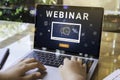 Person using a laptop computer for online training webinars