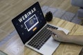 Person using a laptop computer for online training webinars. Royalty Free Stock Photo