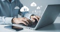 Person using laptop with digital cloud data transfer icons and documents technology Royalty Free Stock Photo