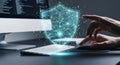 Person using laptop with digital security shield protection display above keyboard Royalty Free Stock Photo