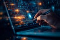 person using laptop and holding pen to check boxes on digital interface showcasing technology and productivity Royalty Free Stock Photo