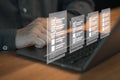 Person using a laptop, interacting with digital checklist displayed as floating icons on the screen.