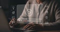 Person using laptop for online learning with video player and educational icons Royalty Free Stock Photo