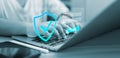 Person using laptop for secure login with shield icon and password interface. Concept of cybersecurity, data privacy, internet Royalty Free Stock Photo