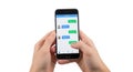 Person using a messaging app on a smartphone with chat bubbles visible isolated on white background Royalty Free Stock Photo