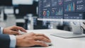 Person using a mouse and keyboard to interact with a data analytics dashboard on a computer Royalty Free Stock Photo