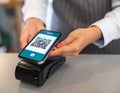 Person Using Smartphone for Contactless Payment at Counter Royalty Free Stock Photo