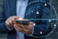 Person using smartphone with digital security lock icons and binary code overlay Royalty Free Stock Photo