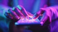 Person using smartphone with glowing touchscreen under vibrant neon lighting creating a futuristic and immersive digital Royalty Free Stock Photo