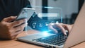 Person using smartphone and laptop with digital interface for online search and data management Royalty Free Stock Photo