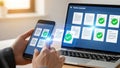 Person using smartphone and laptop for document management and digital verification Royalty Free Stock Photo