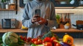 Person using smartphone in kitchen.AI generated image Royalty Free Stock Photo