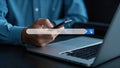 Person using a smartphone with a search bar overlay for online searching or data retrieval