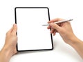 Person using a stylus to draw on a digital tablet screen Royalty Free Stock Photo