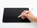 A person using a stylus to interact with a large touchscreen tablet Royalty Free Stock Photo