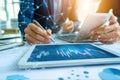 Person using tablet device displaying a graph for data analysis and business presentation Royalty Free Stock Photo