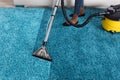 Person Using Vacuum Cleaner For Cleaning Carpet Royalty Free Stock Photo