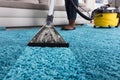 Person Using Vacuum Cleaner For Cleaning Carpet Royalty Free Stock Photo