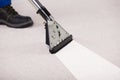 Person Using Vacuum Cleaner For Cleaning Carpet Royalty Free Stock Photo