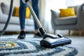 Person vacuum cleaning a colorful rug Royalty Free Stock Photo