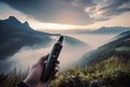 person, vaporizing and smoking device with view of breathtaking natural landscape Royalty Free Stock Photo