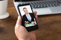 Person Videochatting With Colleague On Mobile Phone Royalty Free Stock Photo