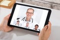 Person Videoconferencing With Doctors On Digital Tablet