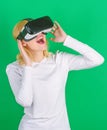 A person in virtual glasses flies in room space. Person with virtual reality helmet isolated on green background. Woman Royalty Free Stock Photo