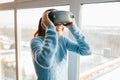 A person in virtual glasses flies to pixels. The woman with glasses of virtual reality. Future technology concept
