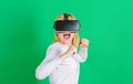 Person with virtual reality helmet isolated on green background. Woman with VR. Virtual reality experience. Royalty Free Stock Photo