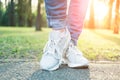 Person walking in gray running shoes, closeup Royalty Free Stock Photo