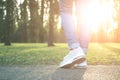 Person walking in gray running shoes, closeup Royalty Free Stock Photo