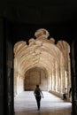 Person walking in Jeronimos Monastery cloister Royalty Free Stock Photo