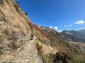 Person walking on a mountain trail in Uttarakhand