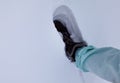 Person walking on snow with leather boots and winter cloathing Royalty Free Stock Photo