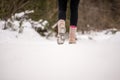 Person walking through snow wearing boots Royalty Free Stock Photo