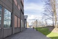 A person walking on the walkway next to a building in Portland, Oregon