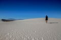 Person walking on white sand dunes, White Sands National Monument, New Mexico, USA Royalty Free Stock Photo