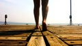 A person walking on a wood deck Royalty Free Stock Photo