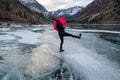 A person walks across a frozen lake Royalty Free Stock Photo