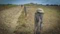 a person walks on a difficult road strewn with boulders