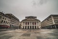 Architecture and lifestyle: a person walks by La Monnaie De Munt or Koninklijke Muntschouwburg, Brussels